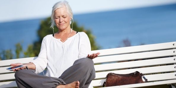 woman meditating outside - Mindfulness Meditation App